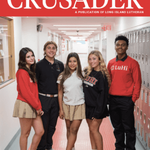 cover of the Crusader Magazine featuring students posing for picture in newly renovated hallway